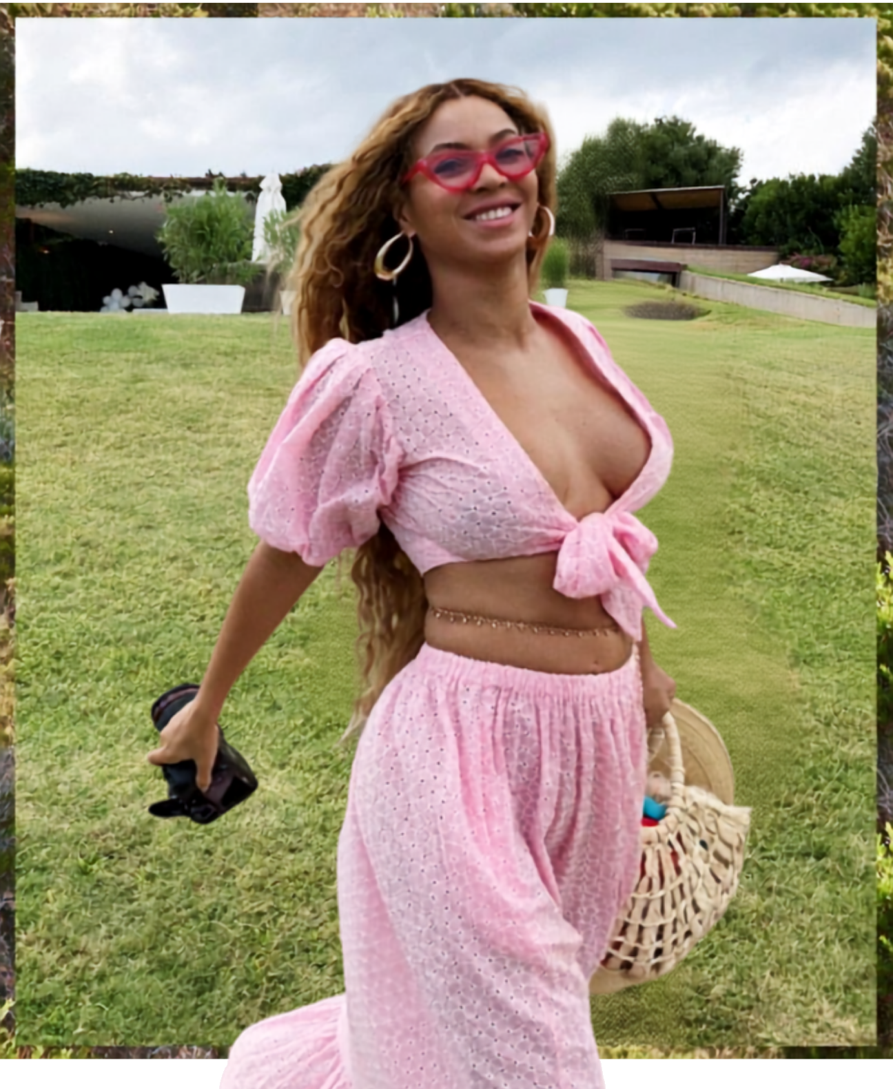 Beyoncee in a pink outfit holding a Nannacay bag in the garden