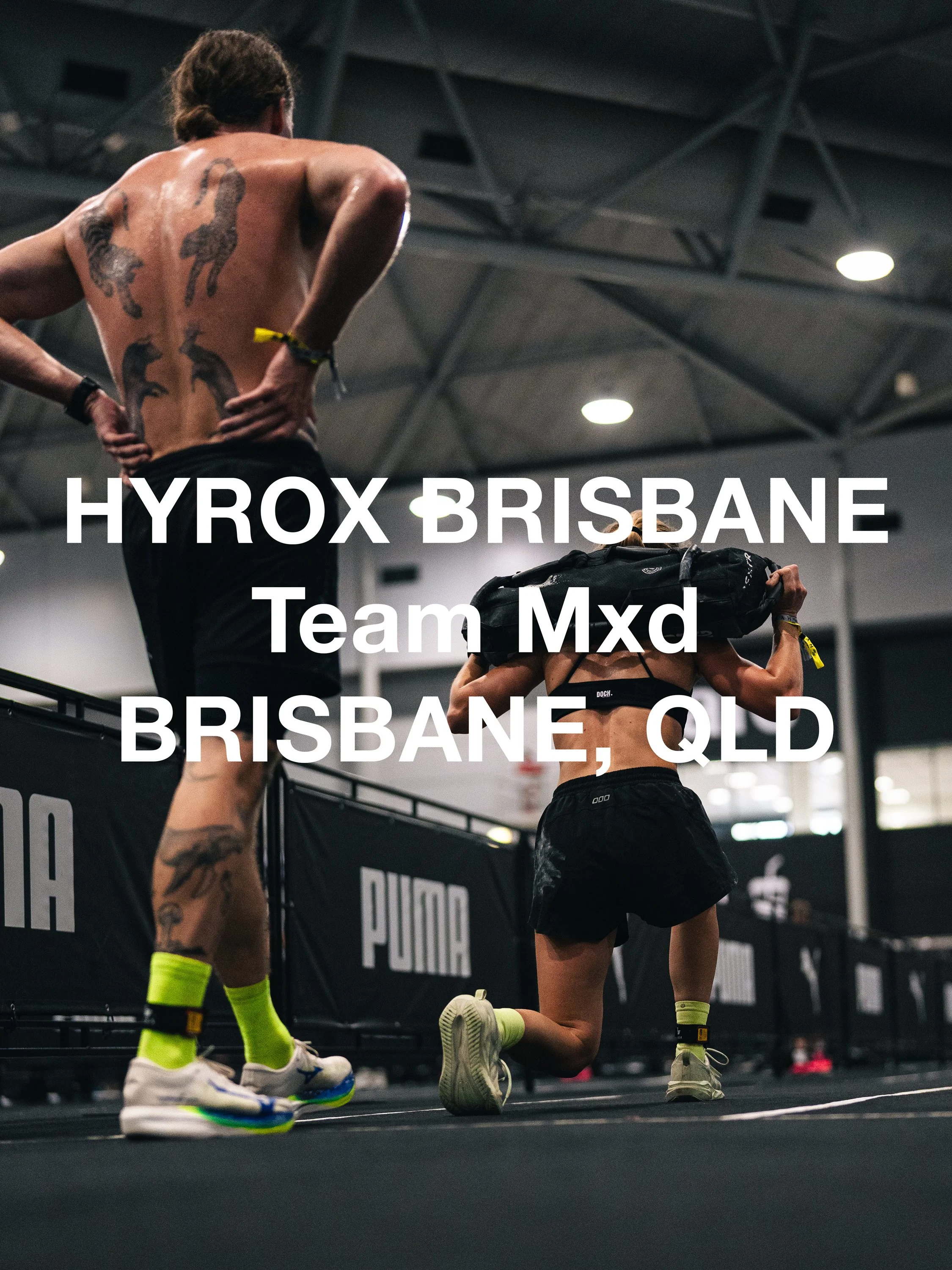 hyrox in australia couple weight lifting and competing in high energy brisbane competition in queensland australia