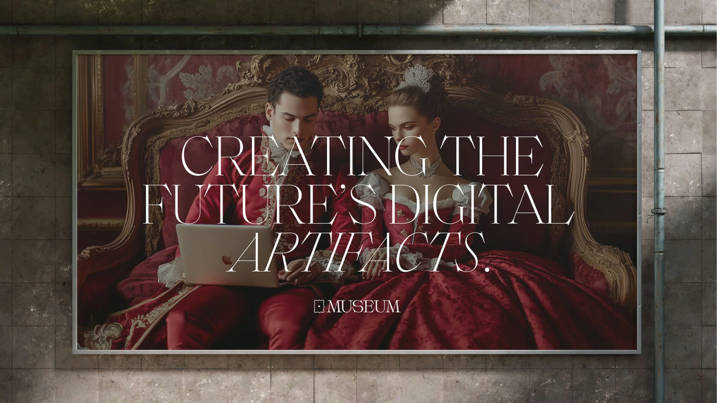 A large museum advertisement featuring a man and a woman dressed in elaborate, historical-style clothing, sitting on a luxurious red velvet sofa. The man is holding a laptop, and the woman is looking at it. The text on the sign reads "Creating the future's digital artifacts."