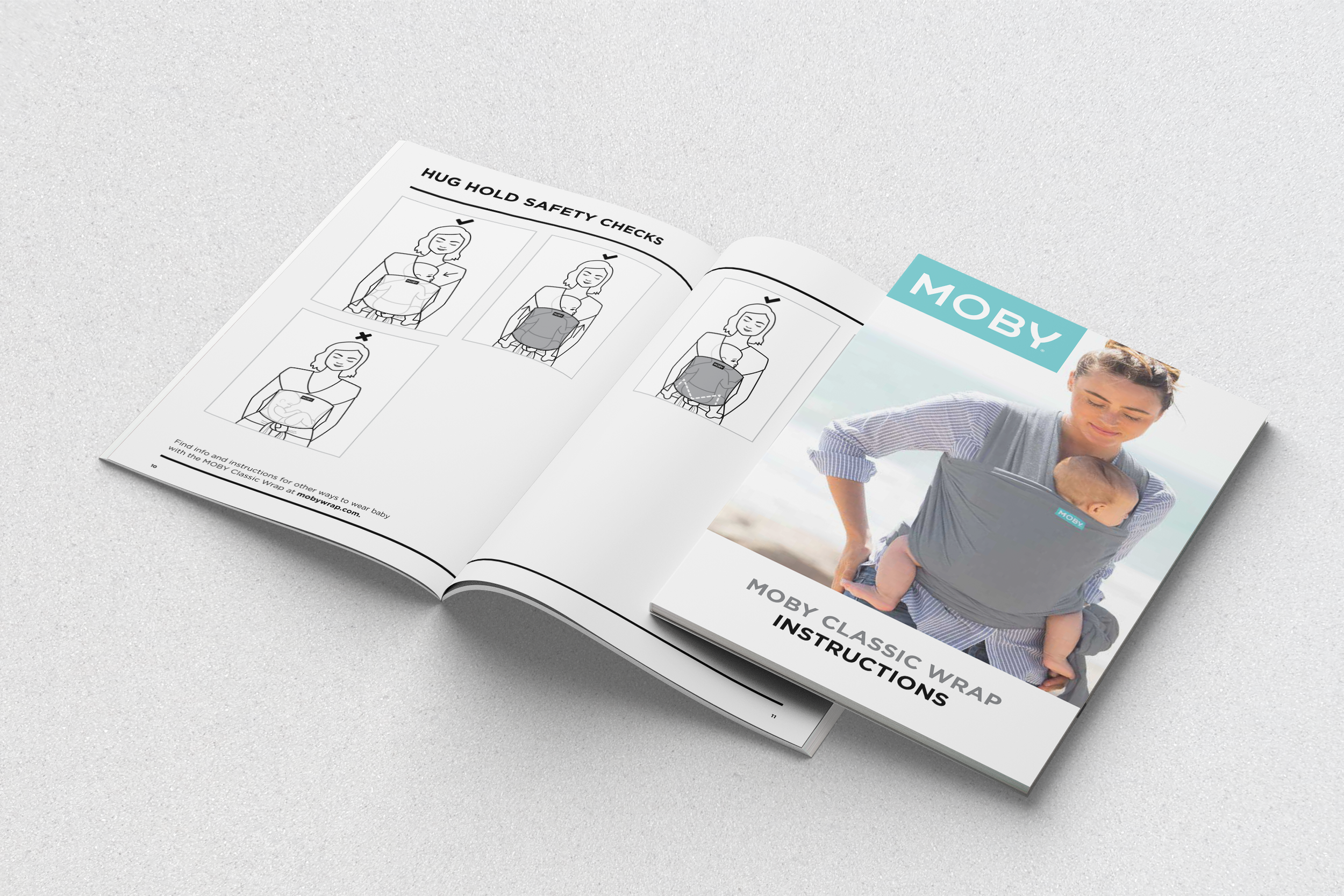 Open booklet with instructions on how to use a Moby classic wrap, featuring illustrations and a photo of a woman wearing a baby in the wrap at the beach.