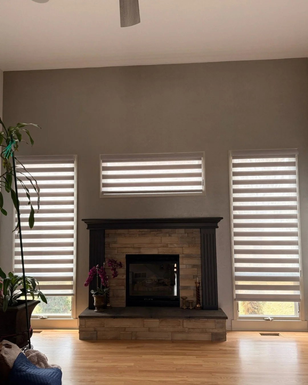 Bringing a little extra "home sweet home" to Omaha. 🏠 We love how these dual shades perfectly frame this fireplace, adding texture and modern style to the living room.

If you&rsquo;re looking for custom window treatments in Omaha, NE, we&