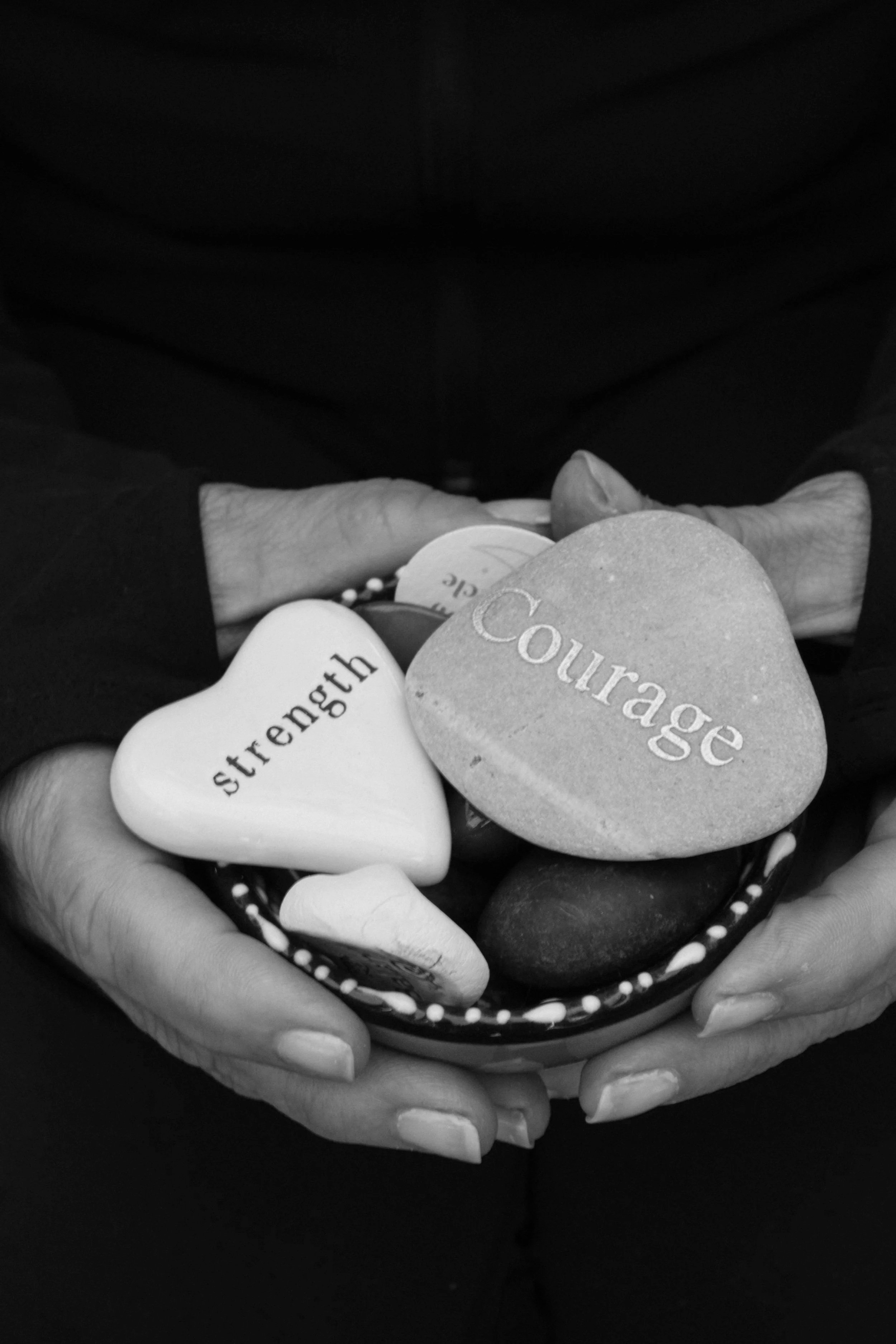 Stones that say " Strength" and "Courage"