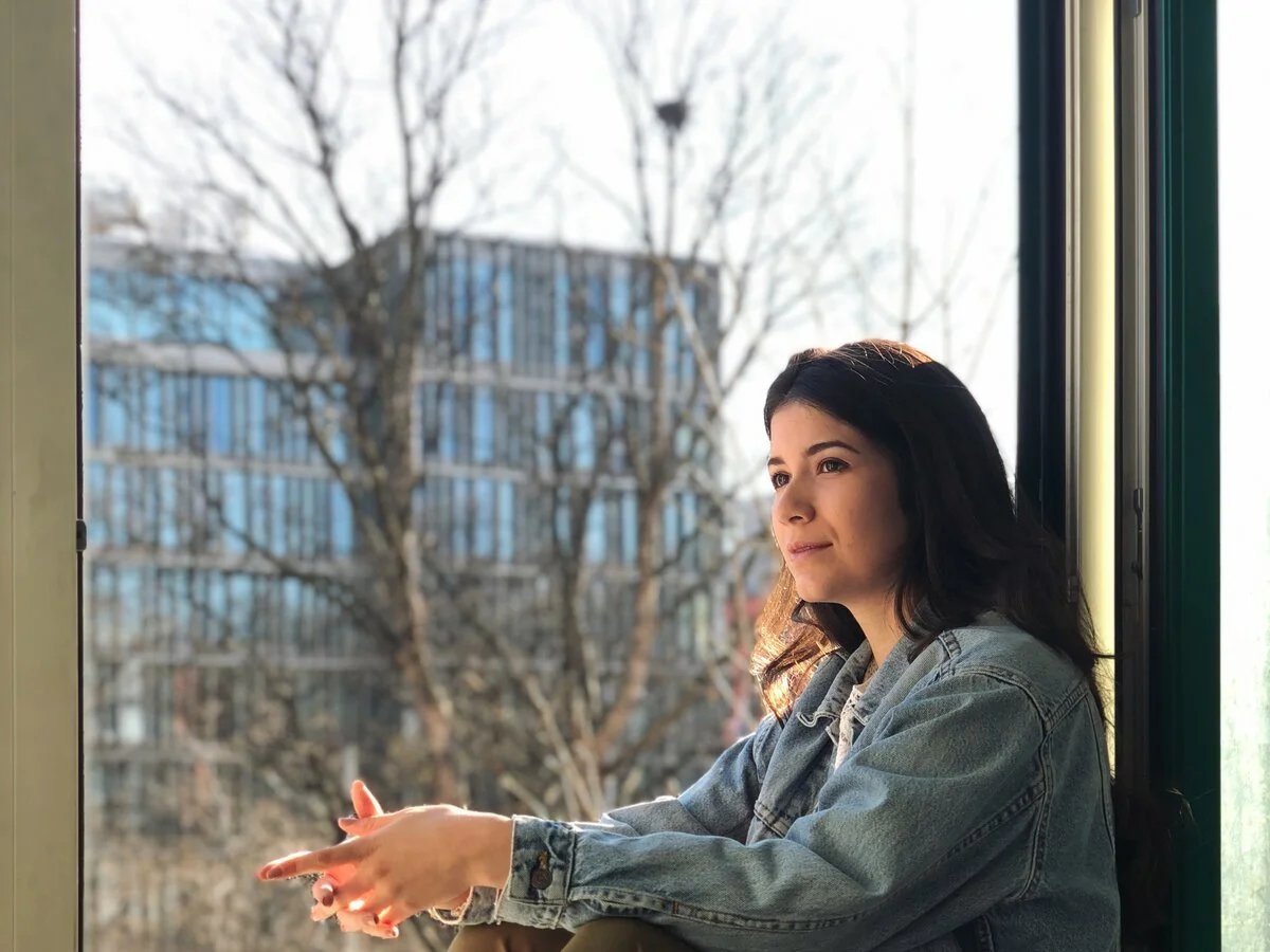 Person feeling hopeful while reflecting on progress in couples therapy.