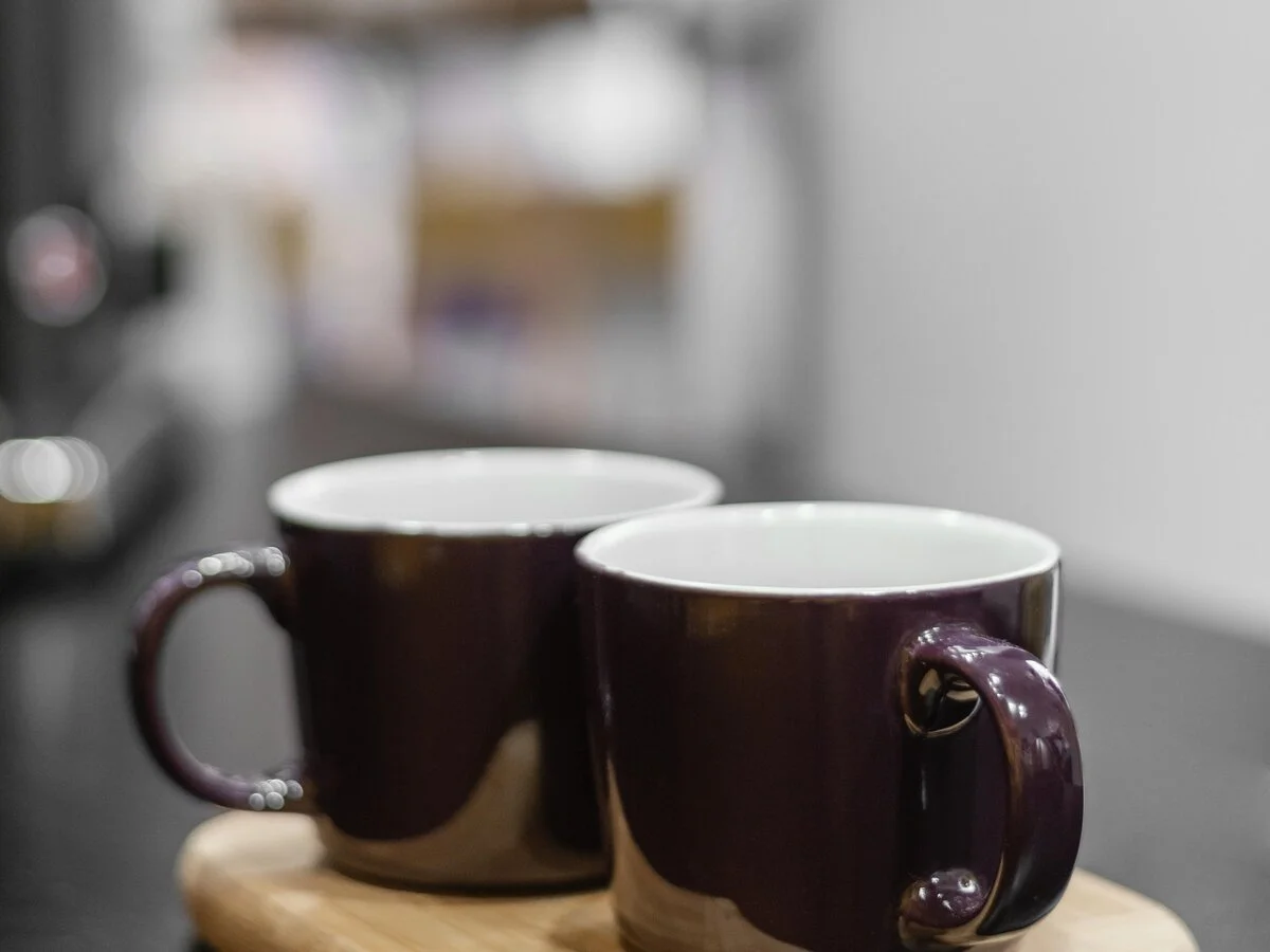 Two mugs sitting close together, symbolizing emotional closeness and unspoken needs in a relationship