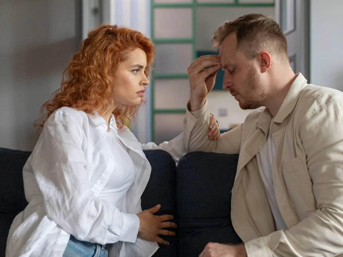 Couple talking quietly after realizing their relationship has become focused more on daily responsibilities than emotional connection.