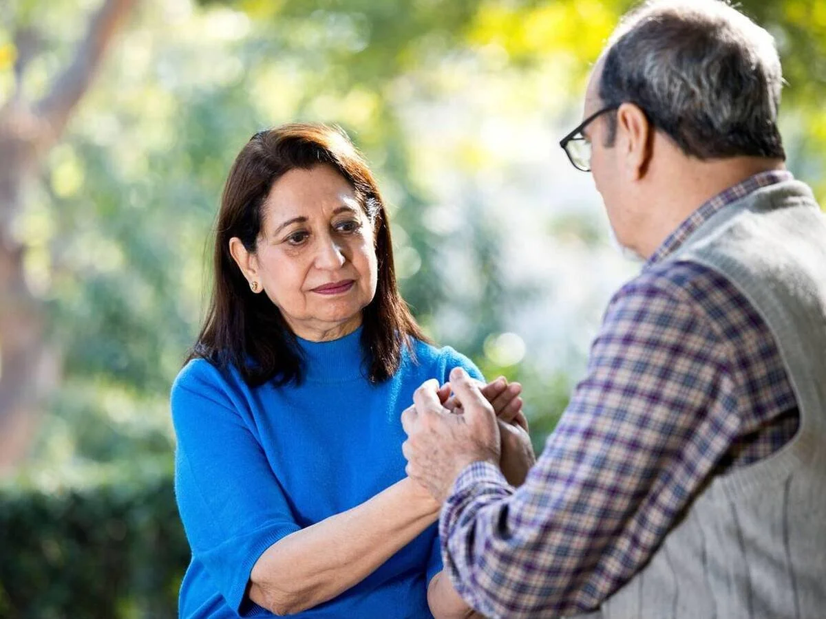 Couple reconnecting emotionally after conflict with support from couples therapy.