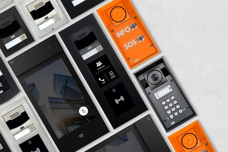 Modern commercial video intercom panels with touchscreen displays, keypad entry, camera modules, and emergency SOS buttons.