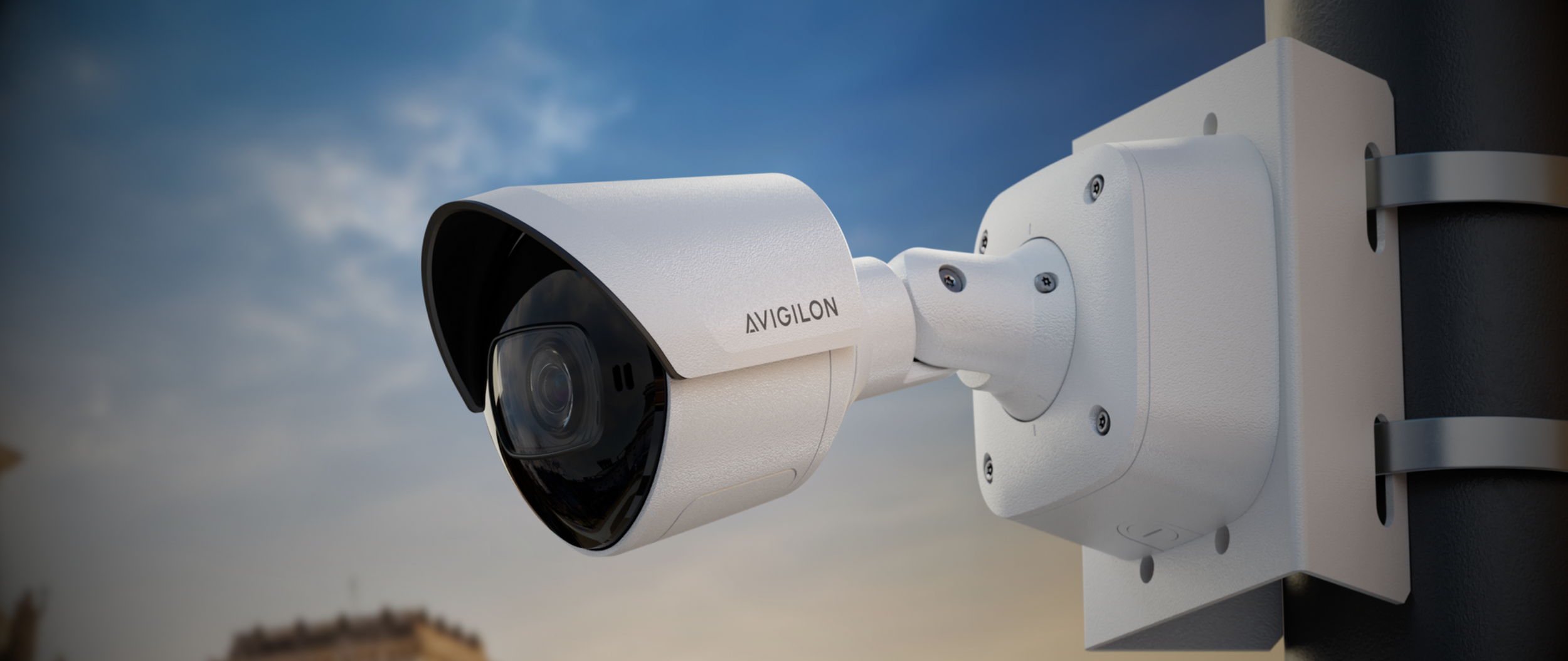 Avigilon outdoor security camera mounted on a building, used to compare Avigilon systems with generic IP cameras.