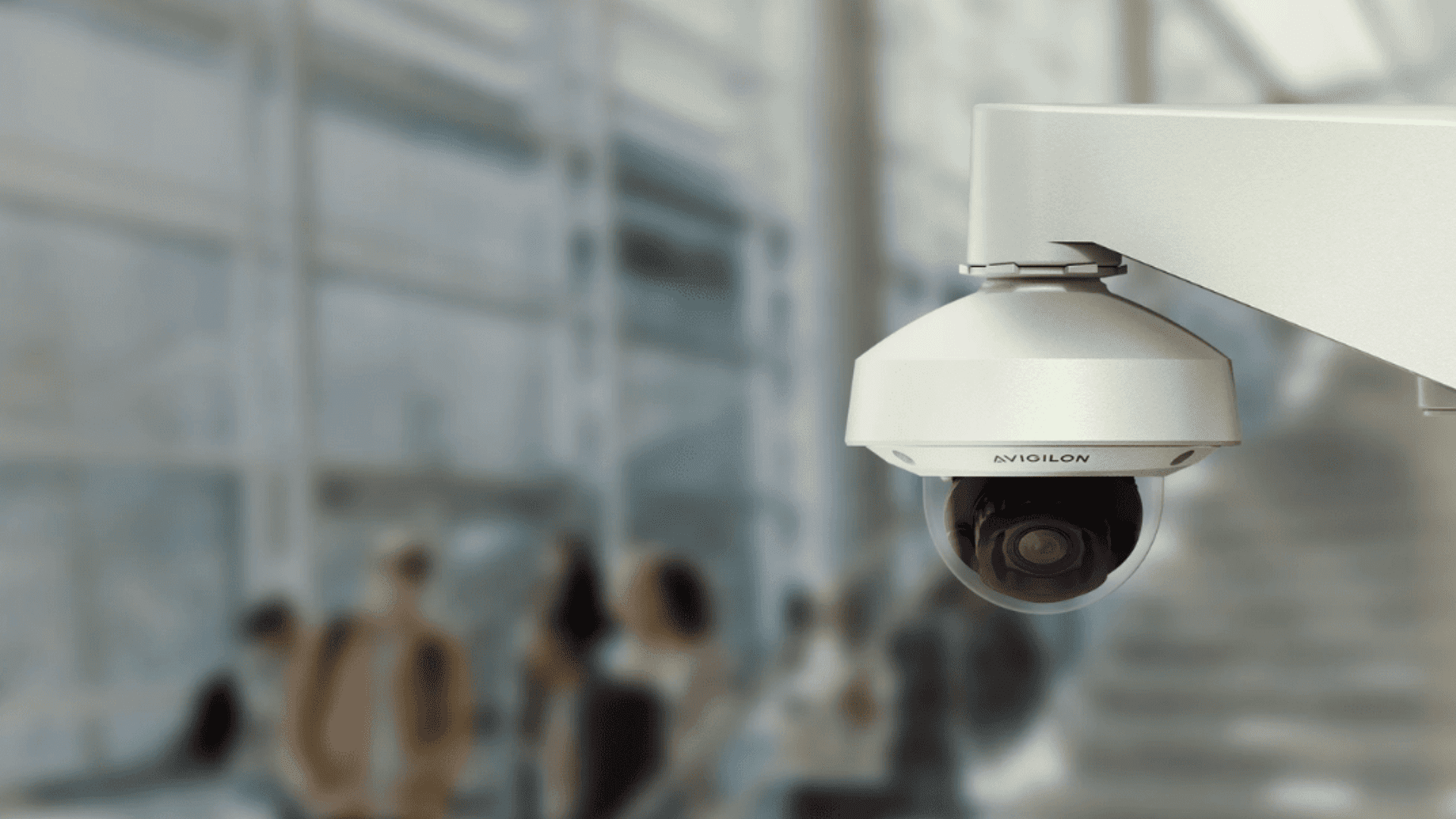 Avigilon dome security camera monitoring activity inside a commercial building for professional video surveillance.