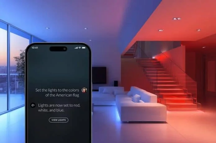 Josh AI app responding to a spoken request to change lighting colors, with the living space lit in red, white, and blue behind it.