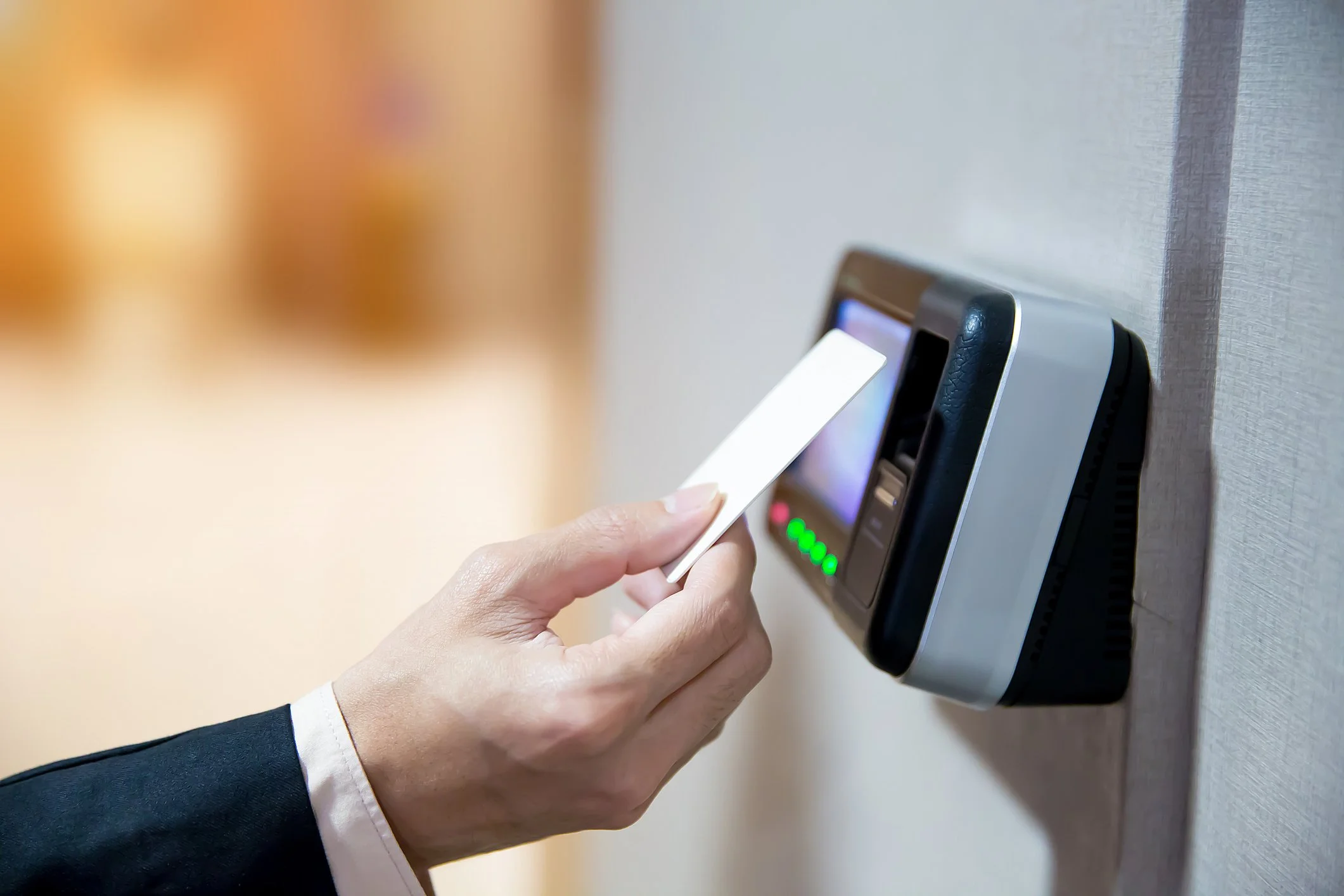 Person using keycard access system at a church entrance, managing secure entry for faith-based facilities.