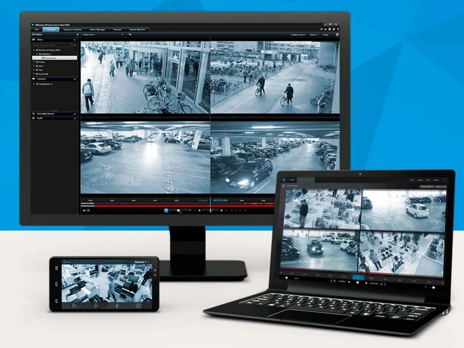 Milestone XProtect video surveillance system displaying multiple security camera feeds across desktop, laptop, and mobile devices.