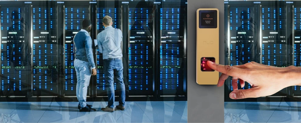 Biometric access control system securing entry to a data center, with technicians working near server racks in the background.