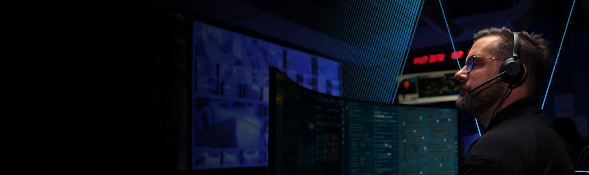 Security operator using Motorola command center software to monitor surveillance systems and manage security operations in real time.