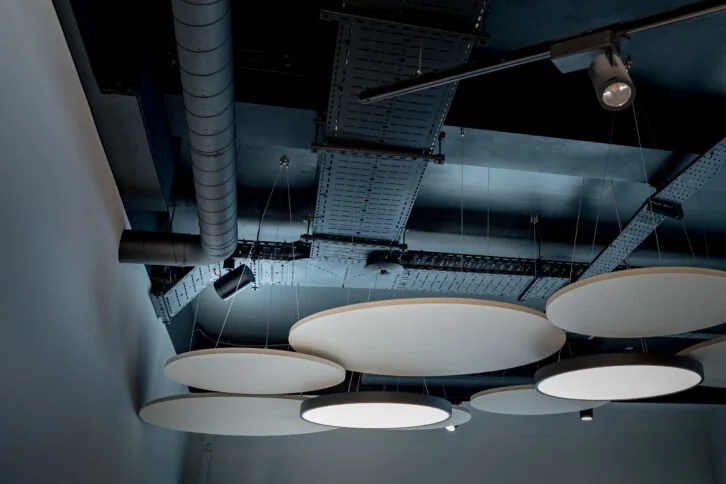 Modern interior with integrated Sonos audio system and ceiling speakers in commercial space