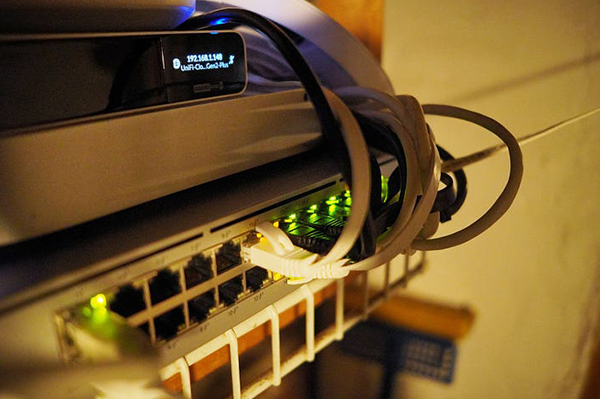 Structured network infrastructure with ethernet cables and switch installation in commercial building