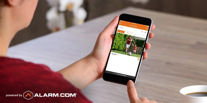 Alarm.com mobile security monitoring app controlling smart home and business security system.