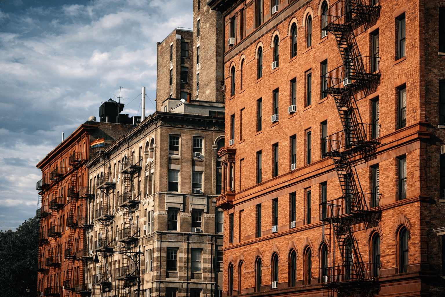 Multi-family residential apartment buildings in New York City requiring secure entry and monitoring systems.