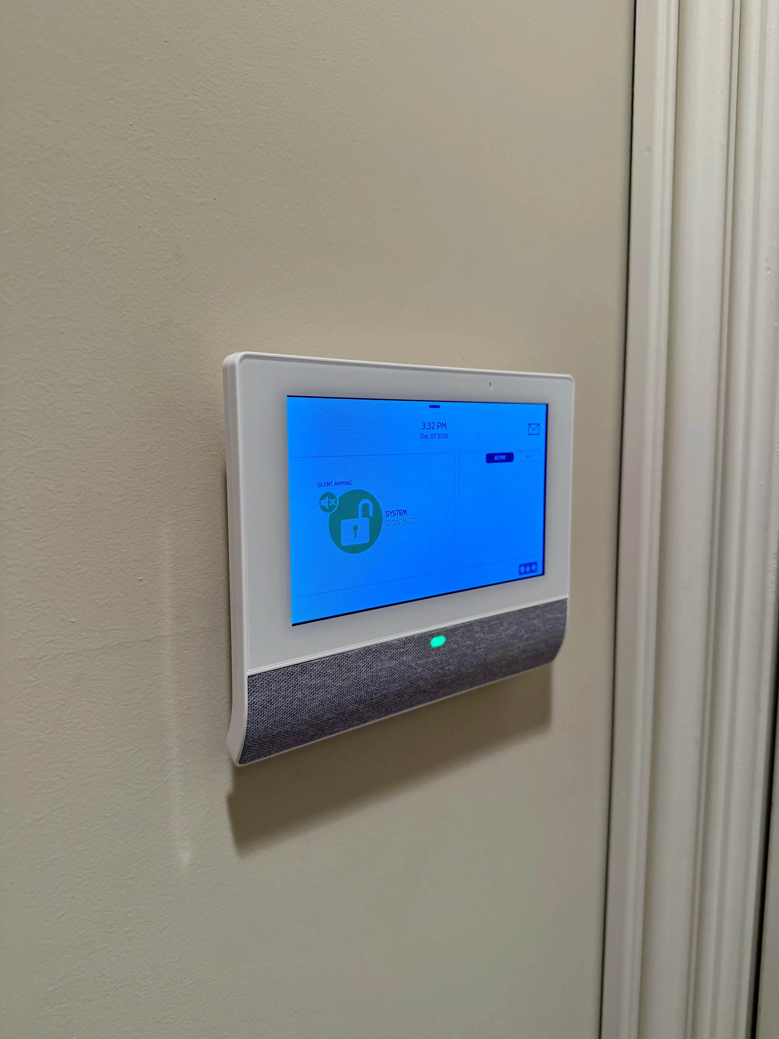 Touchscreen alarm panel showing system disarmed