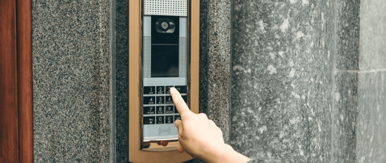 Legacy analog intercom panel installed in NYC building lobby entrance.