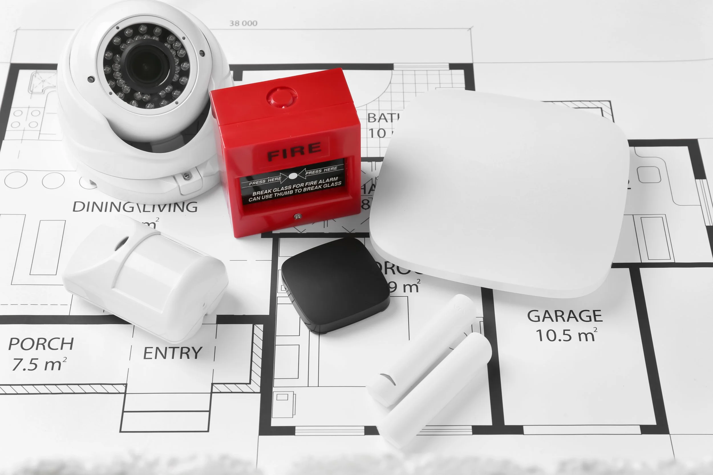 Floor plan mapping CCTV cameras, motion sensors, and fire alarm devices across an integrated building security system.