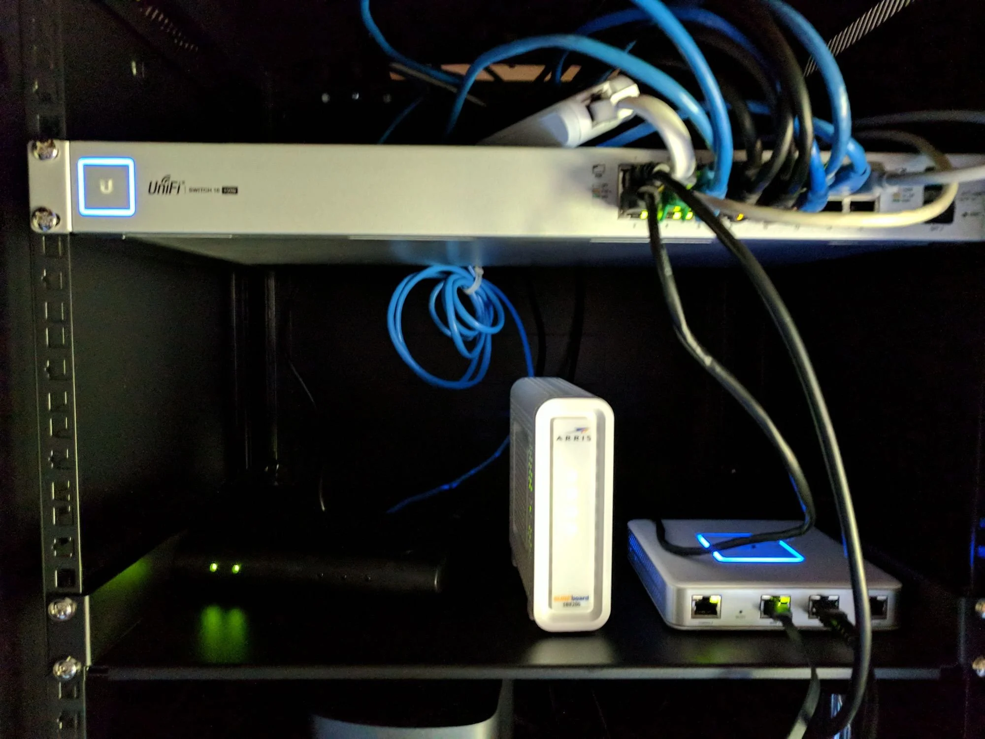Ubiquiti network rack installation with switch, gateway, and cabling in NYC commercial building