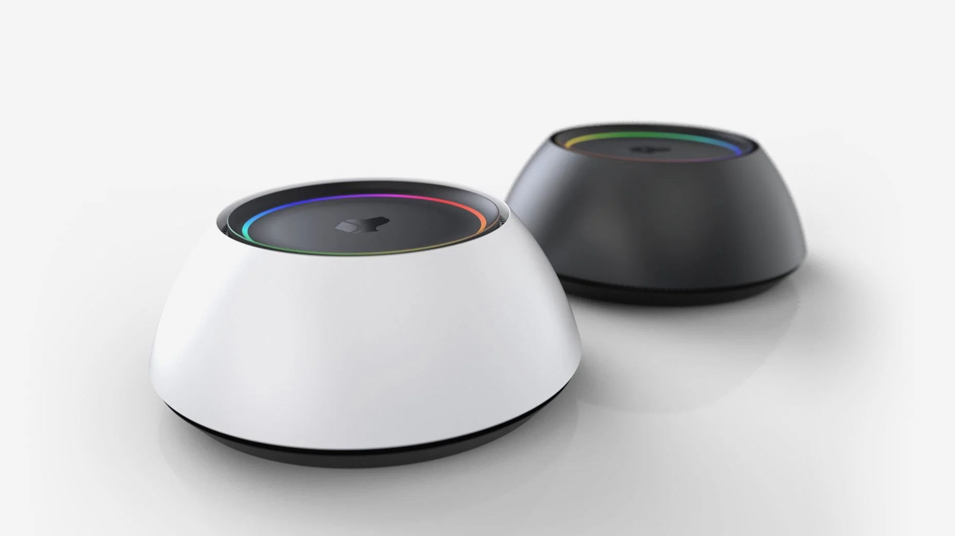 Josh Micro voice control devices in white and black, tabletop units with an illuminated ring that indicates listening status.