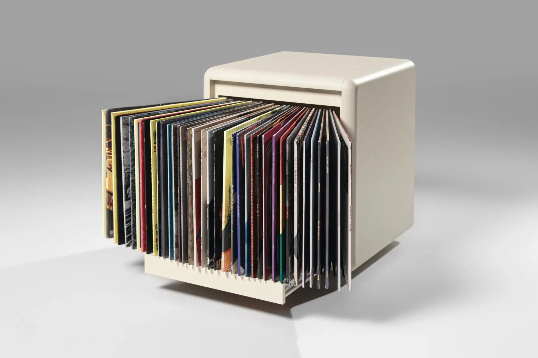 Bloom vinyl browsing element in White Pearl, 3/4 view, filled with records — Groovaly