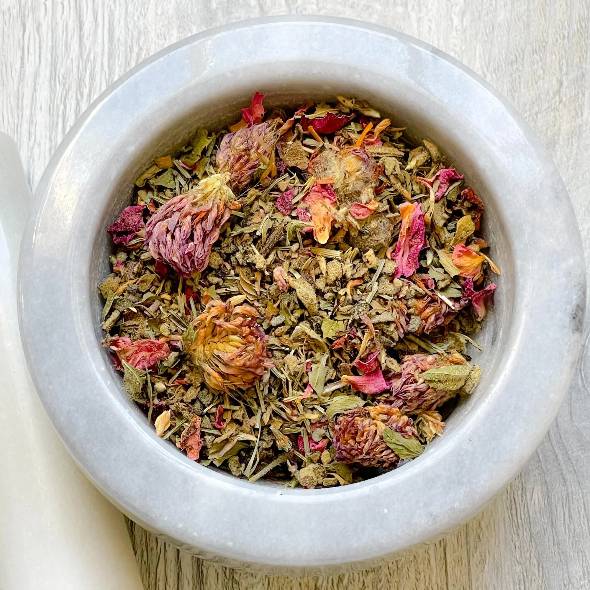 respiratory-herbal-tea-blend-loose.jpeg: loose respiratory tea blend in a mortar