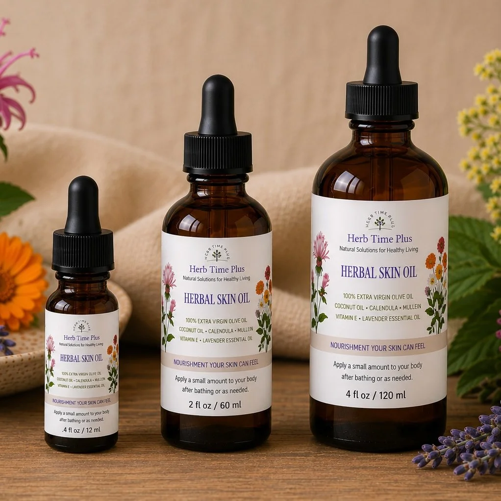 herbal-skin-oil.jpg: three amber bottles of herbal skin oil on a table with flowers and a cloth behind them