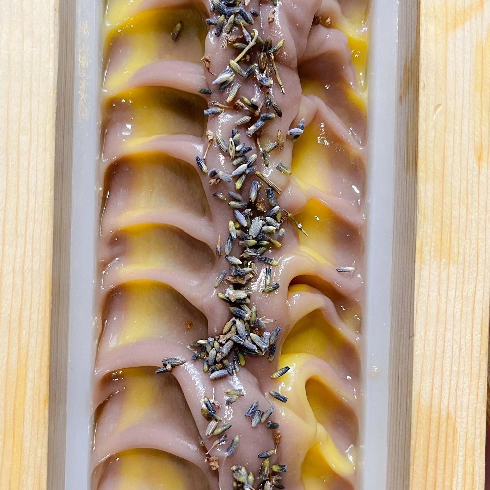 lavender-fields-soap-loaf.jpg: freshly poured lavender fields soap in a soap loaf with lavender flowers sprinkled on top