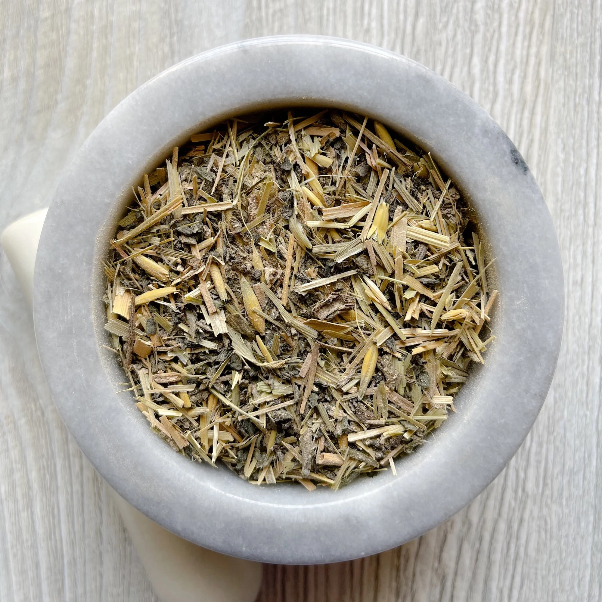 be-nourished-tea.JPEG:loose tea in a marble mortar on a counter