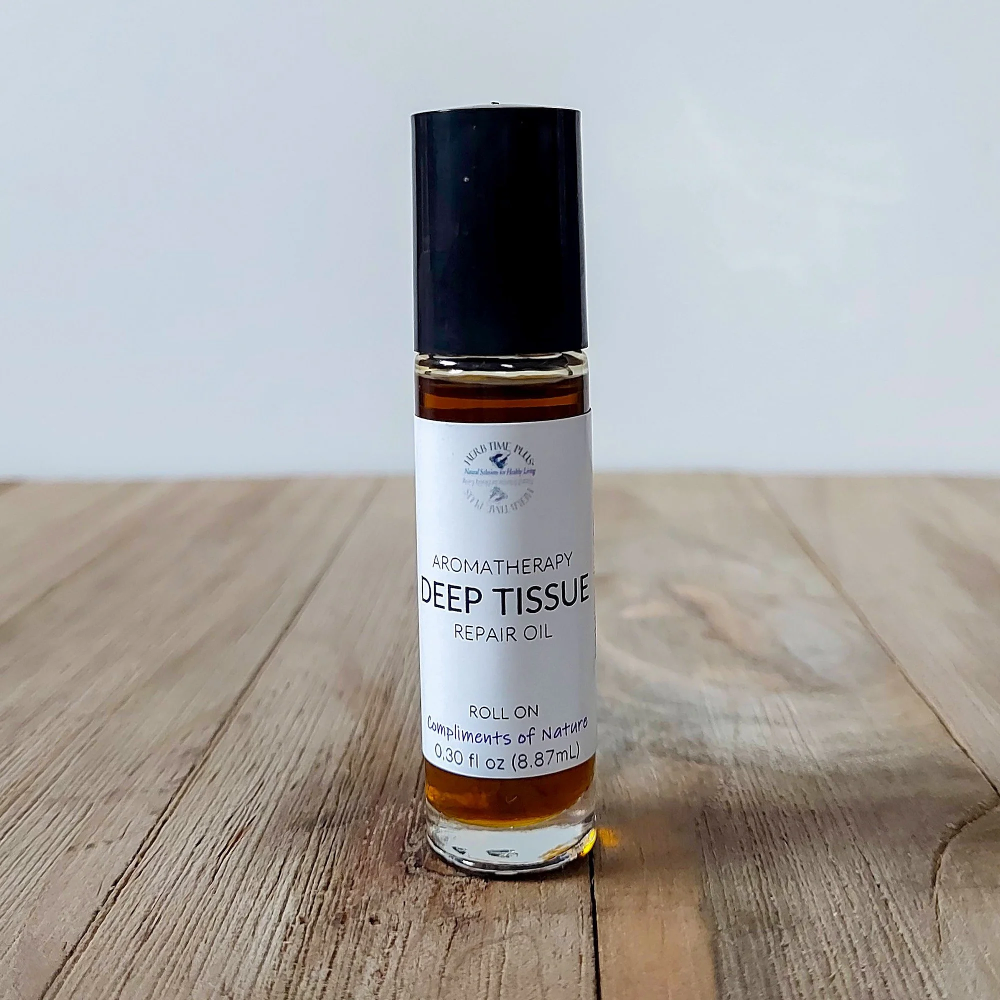 deep-tissue-repair-oil-roll-on.jpeg: deep tissue repair oil in a glass roll on bottle