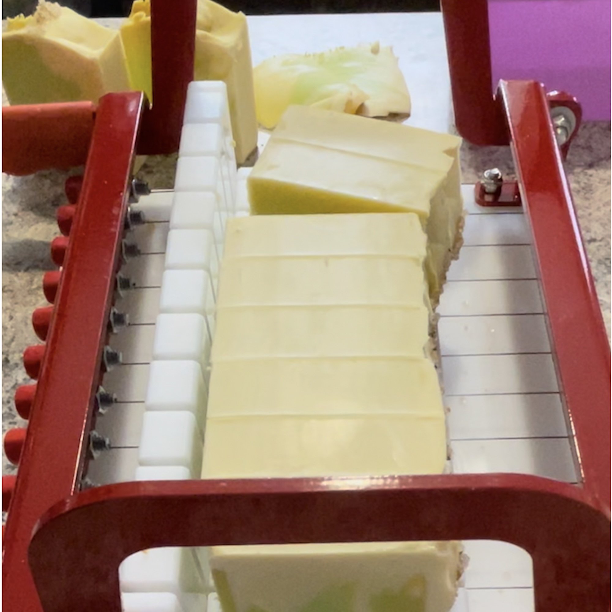 spring-morning-soap-cut.jpg: spring morning soap bars on a soap cutter