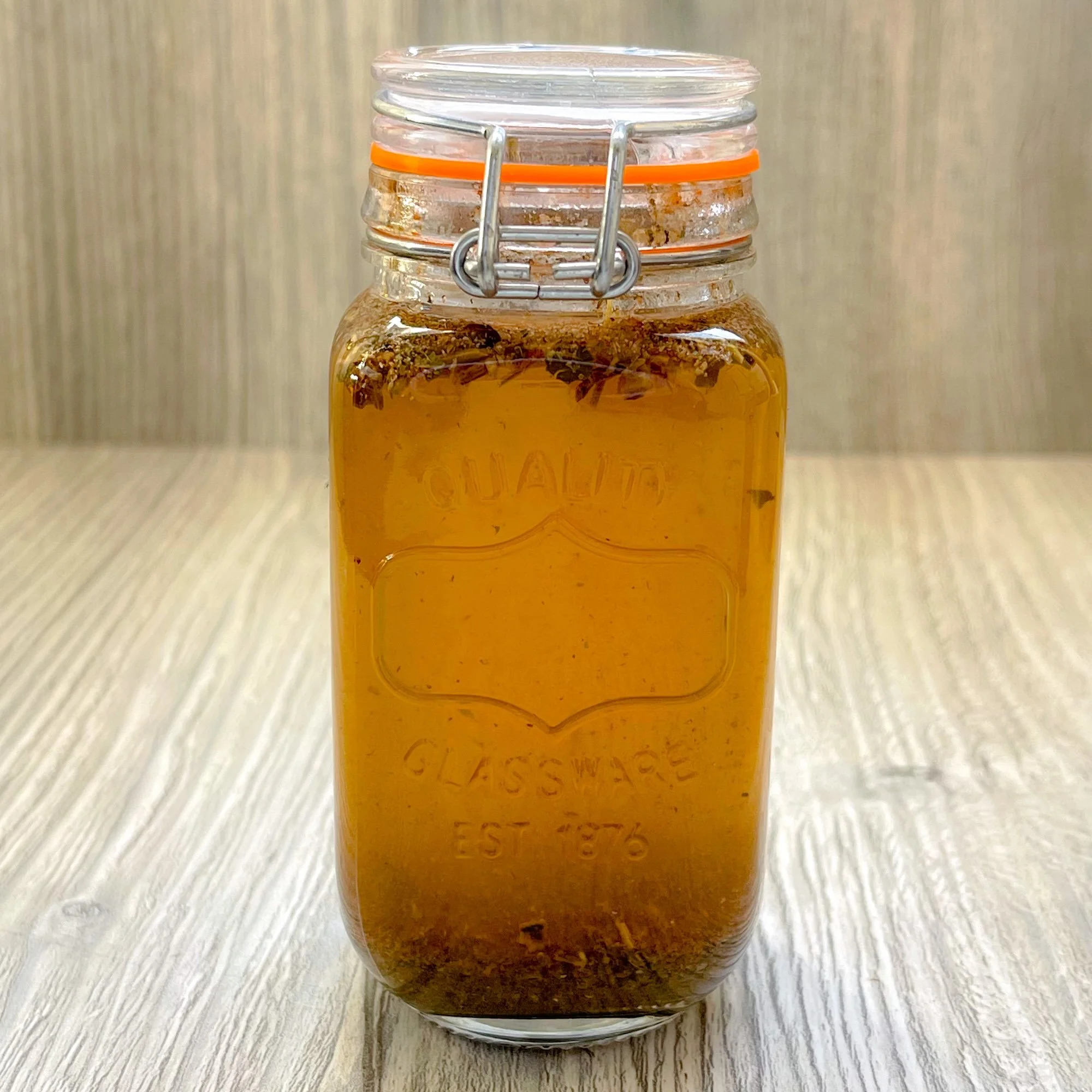 essiac-plus-herbal-tea-blend-brewed.jpeg: brewed essiac plus herbal tea blend in a glass jar
