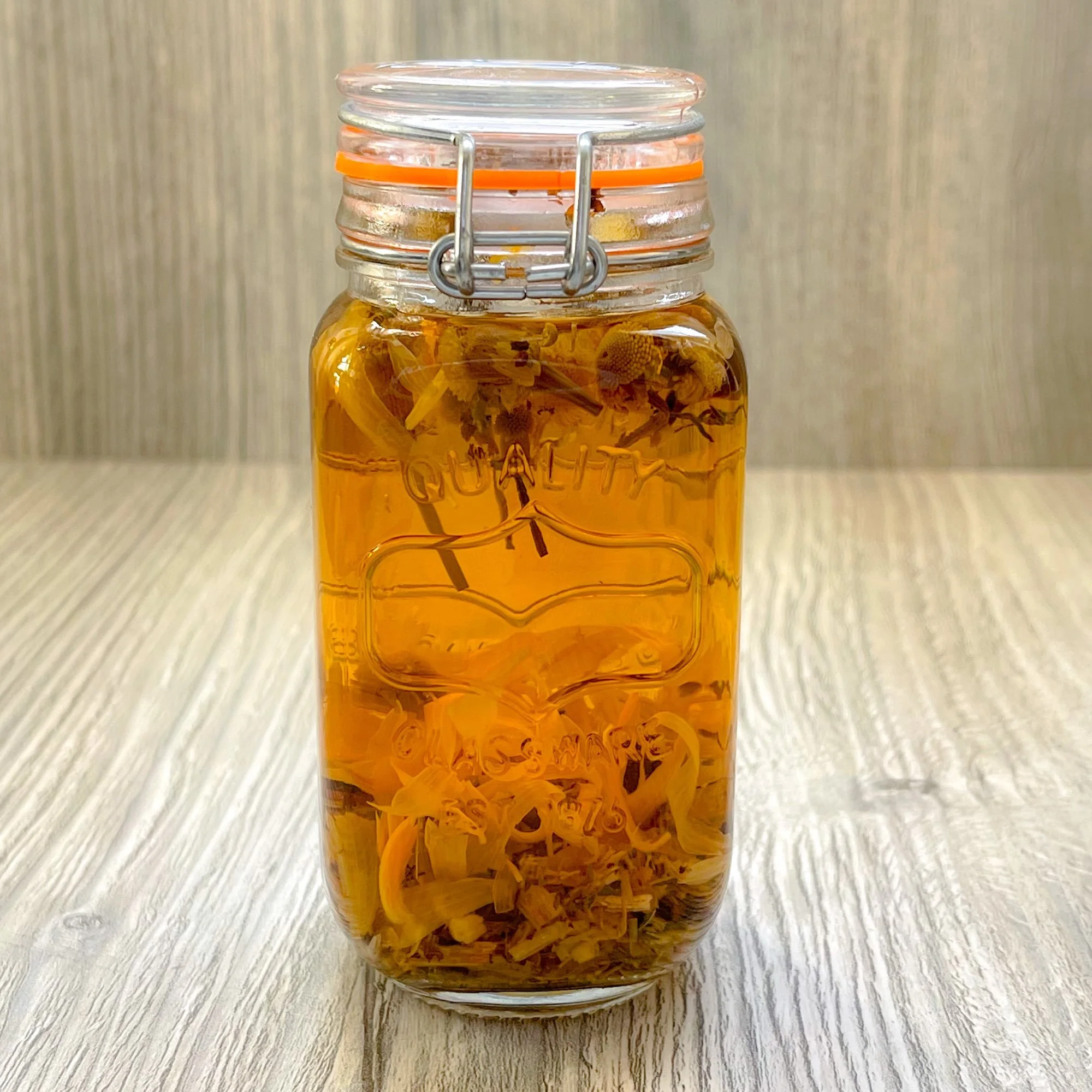 healthy-gut-herbal-tea-blend-brewed.jpeg: brewed healthy gut herbal tea blend in a glass jar