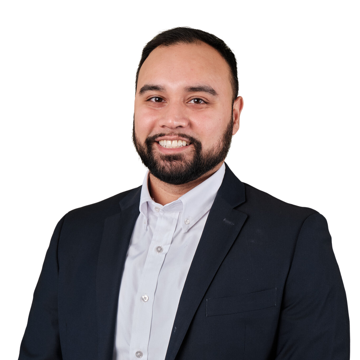 Headshot of a man with a beard in a black suit and white shirt smiling against a white background.