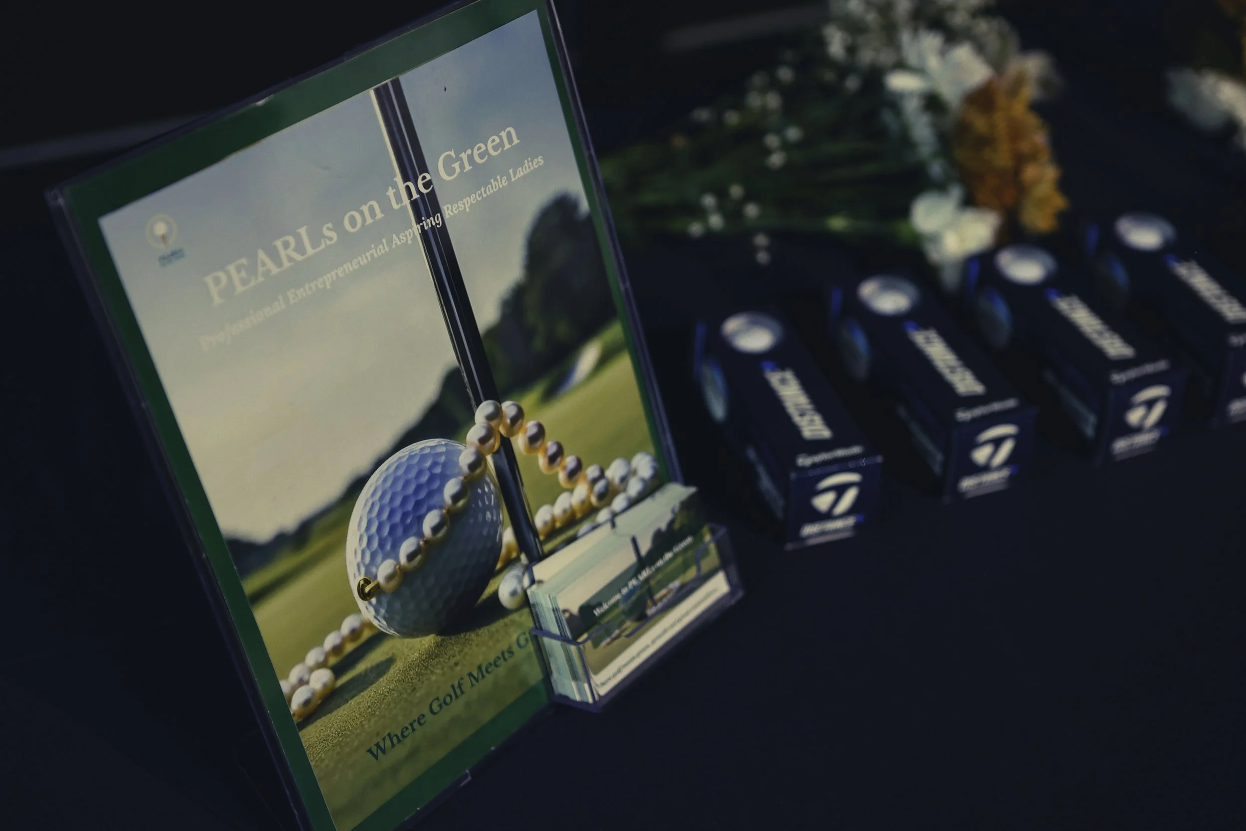sign and golf balls on table.jpeg