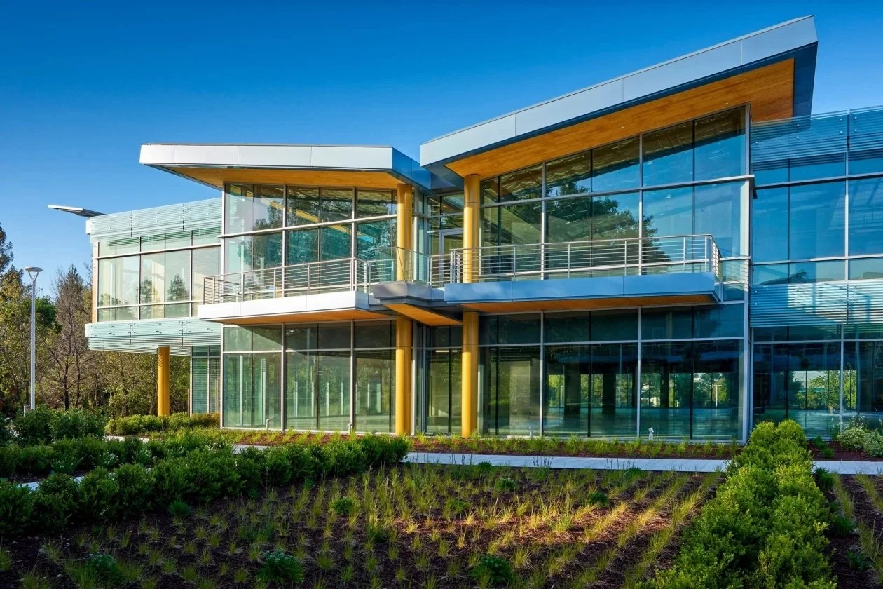 LEED certified modern glass building with sustainable landscaping California green commercial architecture