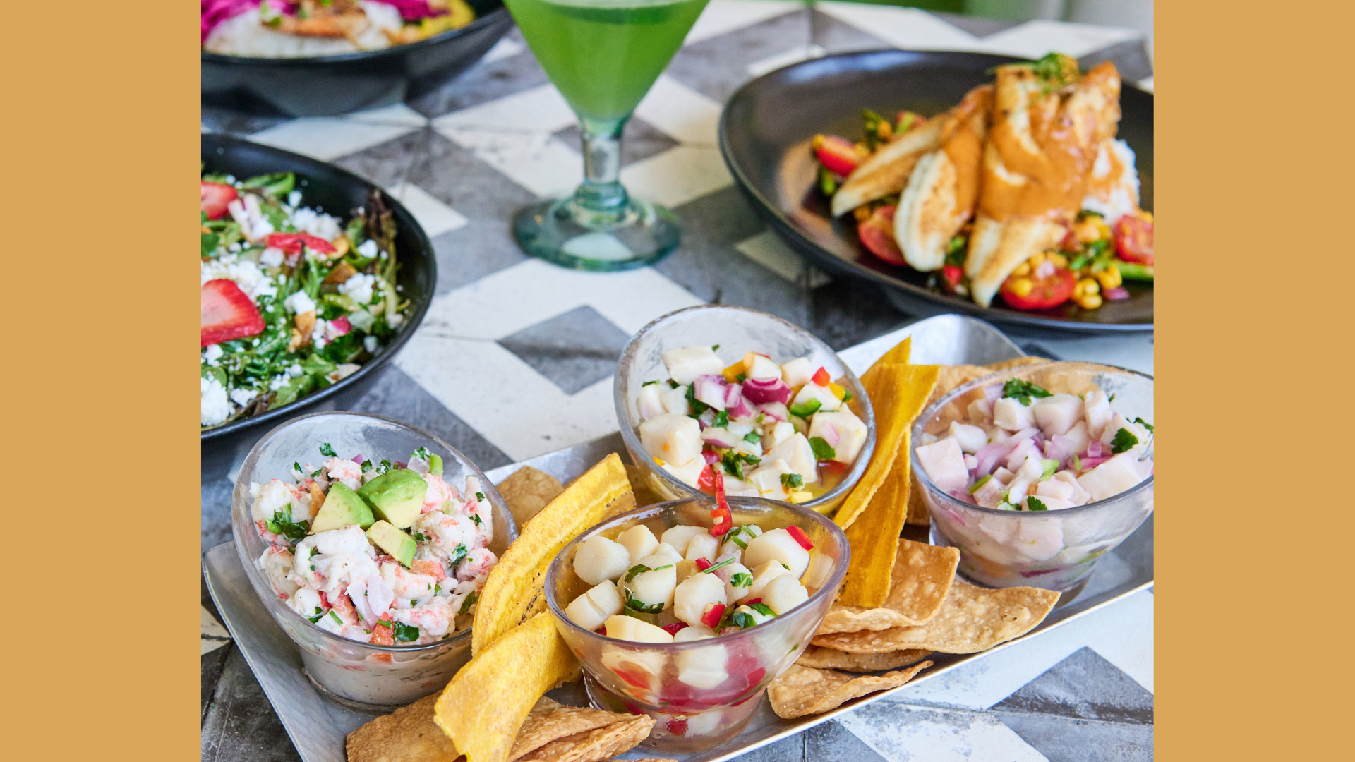 Table featuring El Quatro, ceviche sampler, corvina, scallops, mahi, mango, langoustine, avocado, coconut milk, plantain and tortilla chips, craft cocktail, Seasonal salad with berries, arugula, goat cheese, flounder over chef's choice fresh vegetabl