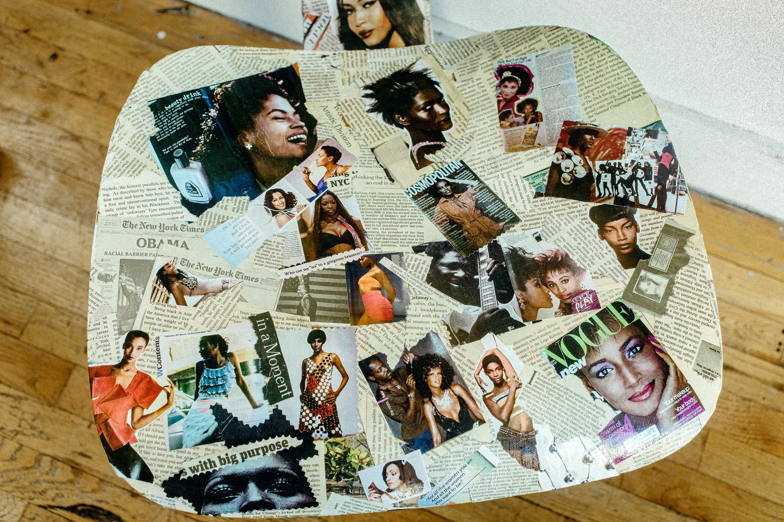   Rosina Mae’s  chair, collaged with archival Black hair magazines 