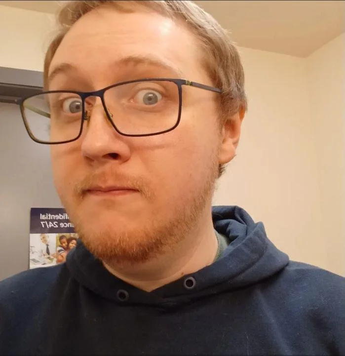 Clayton, a licensed veterinary technician at BoosterPet Bonney Lake