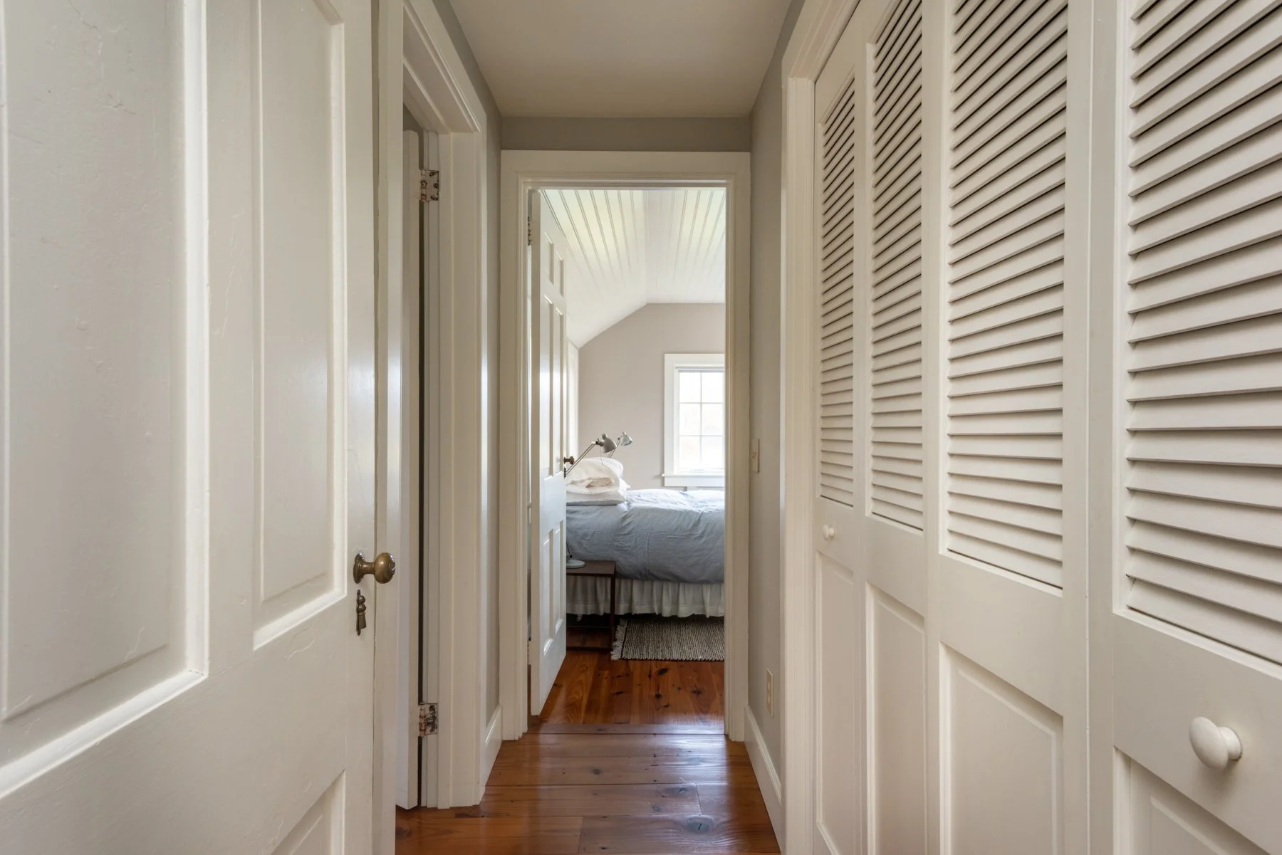 First floor hallway to queen bedroom