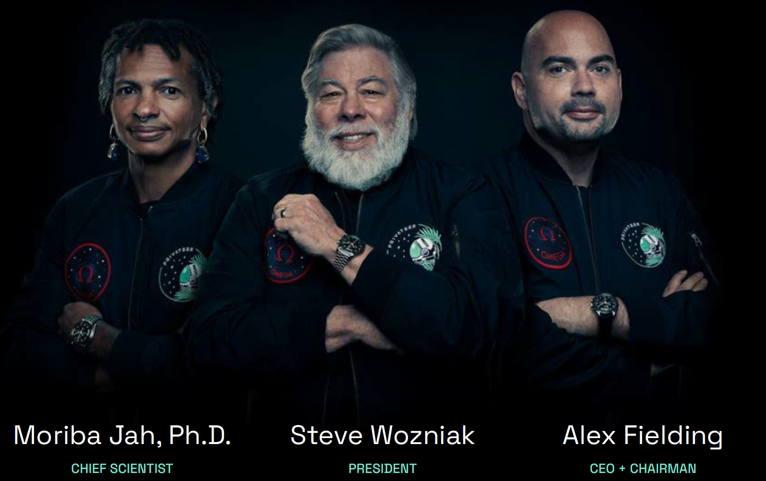Steve Wozniak and two co-founder astronauts in black jackets with patches, standing against a black background, with names and titles: Moriba Jah, Ph.D. - Chief Scientist, Steve Wozniak - President, Alex Fielding - CEO + Chairman.