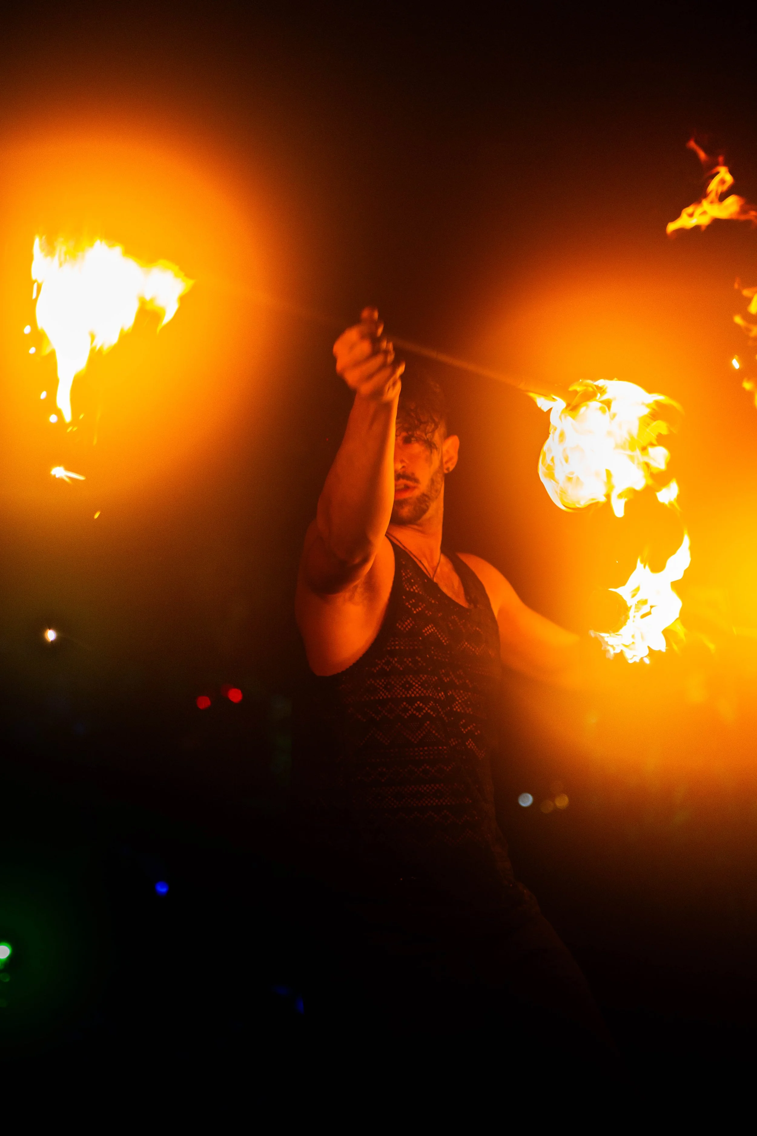 Event photography by catlynsue of a fire dance at night. Light focus on fire and movement in photography. More event at catlynsue.com