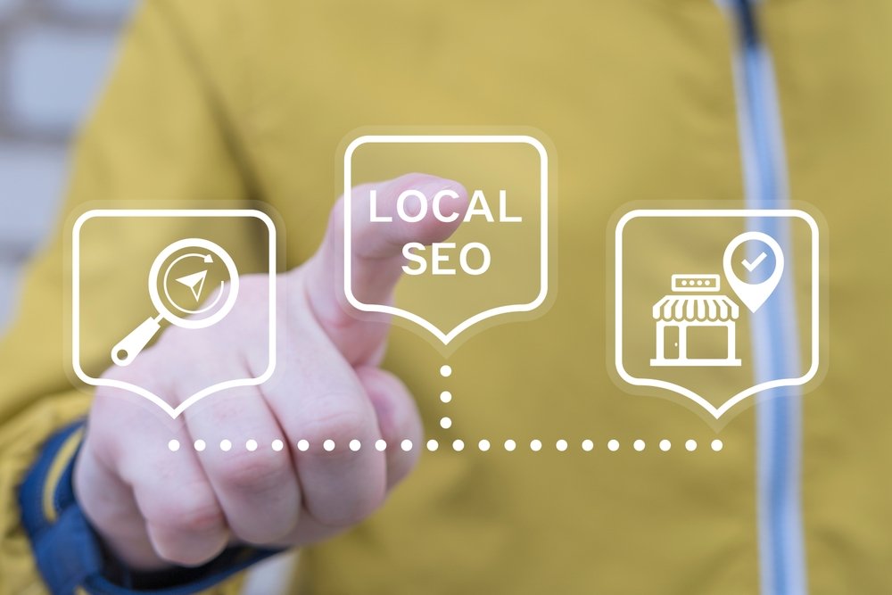 Hand pointing to Local SEO icons for search, maps, and storefront visibility.