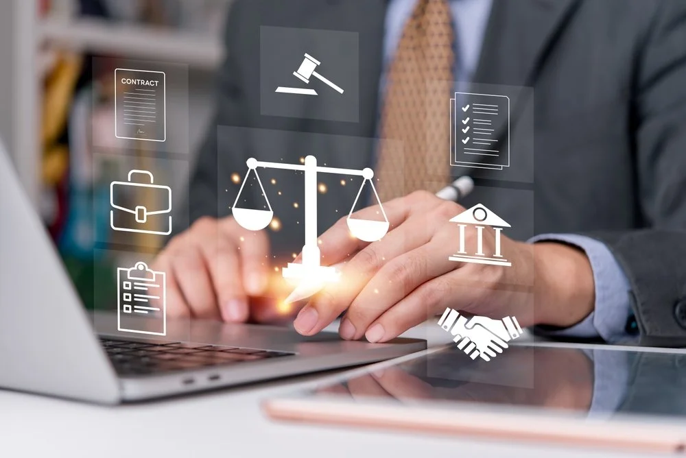 Lawyer working on laptop with digital justice and contract icons.
