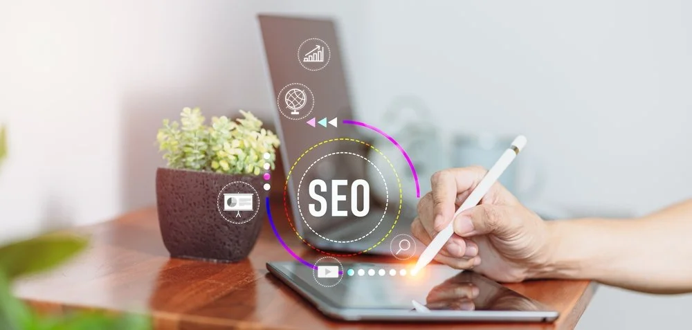 Hand using a tablet with SEO performance icons displayed on a digital interface.