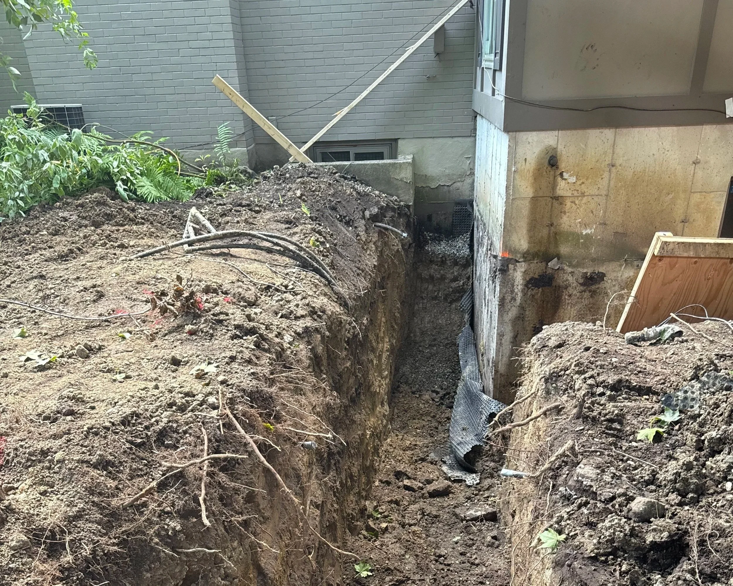 Foundation excavation for basement waterproofing in Collingwood Ontario