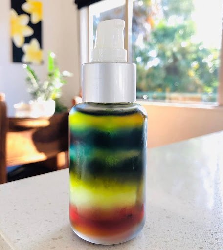 glass-pump-bottle-multi-coloured-face-oil